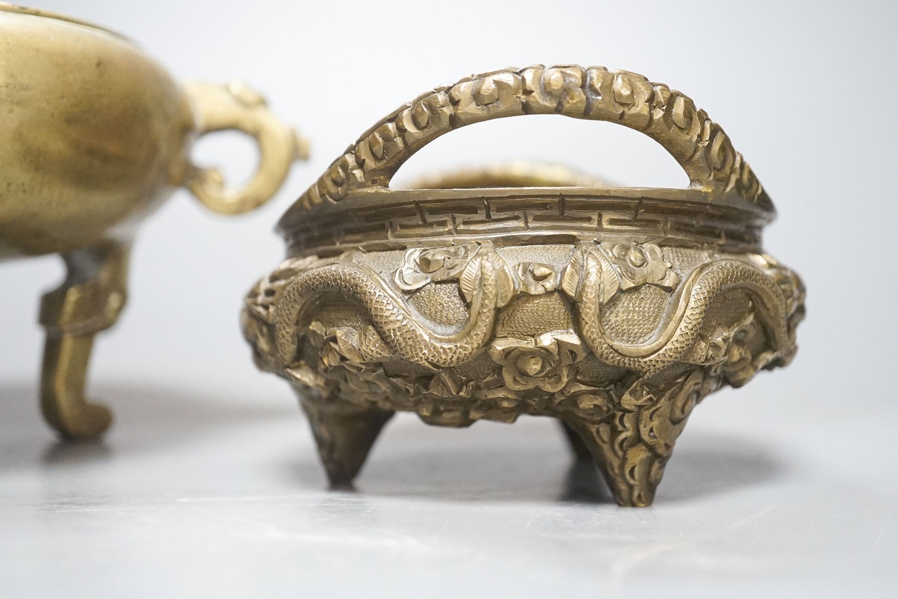 Two Chinese bronze tripod censers, Xuande marks but early 20th century, largest 21cm wide